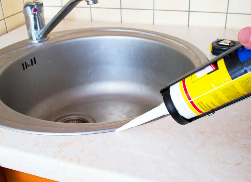 Sink restoration: applying sealant to fix and prevent further cracks